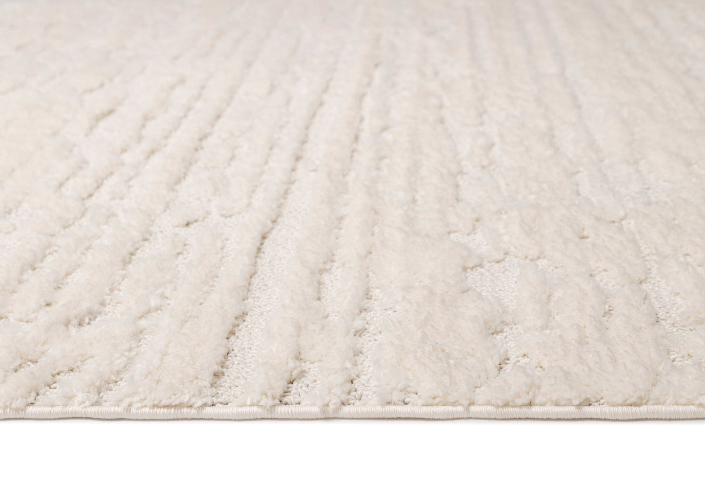 Serena Ivory Cream Textured Tassel Rug